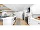 Open-concept kitchen featuring stainless steel appliances, large island, and modern finishes at 9903 Saddle Rd, Tampa, FL 33626