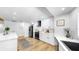 Modern kitchen with stainless steel appliances and white cabinets and a gray rug on the floor at 9903 Saddle Rd, Tampa, FL 33626