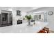 Bright kitchen featuring stainless steel appliances, eat in bar, and white cabinetry at 9903 Saddle Rd, Tampa, FL 33626