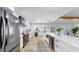 Spacious kitchen with stainless steel appliances and views of the pool area at 9903 Saddle Rd, Tampa, FL 33626
