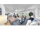 Bright living room featuring hardwood floors, recessed lighting and view of study at 9903 Saddle Rd, Tampa, FL 33626