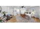 Relaxing main bedroom featuring hardwood floors, neutral decor, and comfortable seating at 9903 Saddle Rd, Tampa, FL 33626