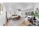 Bright main bedroom featuring wood floors, neutral tones, and glass door to the patio at 9903 Saddle Rd, Tampa, FL 33626