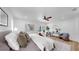 Spacious main bedroom featuring wood floors, ceiling fan, and sliding glass door to patio at 9903 Saddle Rd, Tampa, FL 33626
