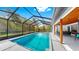 Inviting screened-in pool area offers refreshing swims and outdoor fun in a private setting at 9903 Saddle Rd, Tampa, FL 33626