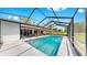 Stunning screened-in pool with a spacious deck, providing a private outdoor oasis for relaxation and enjoyment at 9903 Saddle Rd, Tampa, FL 33626