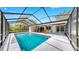 Large screened-in pool area with a spacious deck, offering a private and refreshing outdoor retreat at 9903 Saddle Rd, Tampa, FL 33626
