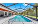 Beautiful screened-in pool with a spacious deck, perfect for outdoor entertaining and relaxation at 9903 Saddle Rd, Tampa, FL 33626