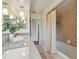 Bathroom features double sinks, granite counters, and a shower at 1443 54Th Ne Ave, St Petersburg, FL 33703