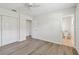 Bedroom features wood floors, a closet, and a bathroom at 1443 54Th Ne Ave, St Petersburg, FL 33703