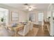 Elegant dining room with natural wood table and bright, neutral decor at 1443 54Th Ne Ave, St Petersburg, FL 33703