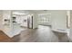 Modern kitchen featuring white cabinets, stainless steel appliances, and open layout at 1443 54Th Ne Ave, St Petersburg, FL 33703
