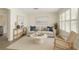Bright living room with neutral tones, modern furnishings, and ample natural light at 1443 54Th Ne Ave, St Petersburg, FL 33703