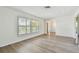 Spacious room featuring new wood-look floors and bright natural light at 1443 54Th Ne Ave, St Petersburg, FL 33703
