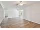 Bright, open-concept living room featuring new floors, ceiling fan, and plenty of natural light at 1443 54Th Ne Ave, St Petersburg, FL 33703
