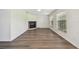 Open living area with fireplace and large windows, creating a cozy atmosphere at 1443 54Th Ne Ave, St Petersburg, FL 33703