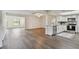 Open-concept kitchen and living space with modern finishes, including new floors at 1443 54Th Ne Ave, St Petersburg, FL 33703