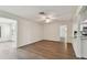 Large living space with wood-look floors and seamless transition to the kitchen at 1443 54Th Ne Ave, St Petersburg, FL 33703