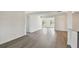 Bright living space with wood-look floors connecting to other rooms at 1443 54Th Ne Ave, St Petersburg, FL 33703
