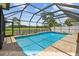 A beautiful screened-in pool offers outdoor leisure and relaxation at 1443 54Th Ne Ave, St Petersburg, FL 33703