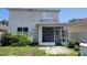 View of backyard, patio area and enclosed porch at 1015 Windton Oak Dr, Ruskin, FL 33570