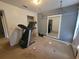 Bedroom featuring wall mirror, open closet, and white trim at 1015 Windton Oak Dr, Ruskin, FL 33570