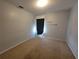 Neutral bedroom featuring neutral paint, carpet and lighting at 1015 Windton Oak Dr, Ruskin, FL 33570