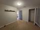 Showing bedroom with light walls, trim, neutral carpet, and door to hallway at 1015 Windton Oak Dr, Ruskin, FL 33570