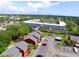 Aerial view of apartment building, parking lot, and surrounding landscape at 1025 82Nd N Ter # 1025D, St Petersburg, FL 33702