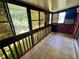 Cozy screened balcony featuring bright natural light and treetop views for relaxing or entertaining at 1025 82Nd N Ter # 1025D, St Petersburg, FL 33702