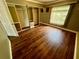Bedroom with a window and a closet with reflective doors at 1025 82Nd N Ter # 1025D, St Petersburg, FL 33702