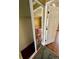 Bright bedroom with hardwood floors, closet with mirror doors, and fresh paint at 1025 82Nd N Ter # 1025D, St Petersburg, FL 33702