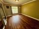 Bedroom with hardwood floors, double-door closet with mirrored doors at 1025 82Nd N Ter # 1025D, St Petersburg, FL 33702