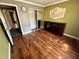 Bedroom featuring hardwood floors, and built in cabinet with glass doors at 1025 82Nd N Ter # 1025D, St Petersburg, FL 33702