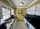 Updated kitchen featuring white cabinets, stone countertops and stainless steel appliances at 1025 82Nd N Ter # 1025D, St Petersburg, FL 33702