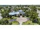 Aerial view of community clubhouse and pool surrounded by lush landscaping at 12004 Legacy Bright St, Riverview, FL 33578