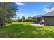 Spacious backyard with a stone patio perfect for outdoor entertaining at 12004 Legacy Bright St, Riverview, FL 33578