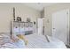 Comfortable bedroom featuring a built-in storage unit and an open doorway leading to the bathroom at 12004 Legacy Bright St, Riverview, FL 33578