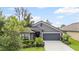 Charming single-story home featuring a well-maintained lawn and a two-car garage in a desirable neighborhood at 12004 Legacy Bright St, Riverview, FL 33578