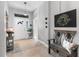 Welcoming foyer with decorative bench, tile flooring, stylish decor, and a well-lit entry at 12004 Legacy Bright St, Riverview, FL 33578