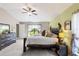Bright and spacious main bedroom featuring soft lighting and a view of the outdoors at 12004 Legacy Bright St, Riverview, FL 33578