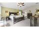 Cozy main bedroom featuring a rustic wood bed frame and an ensuite bathroom at 12004 Legacy Bright St, Riverview, FL 33578