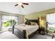 Tranquil main bedroom with a large window offering natural light and a view of the outdoors at 12004 Legacy Bright St, Riverview, FL 33578