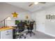 Functional office space with a wooden desk, ergonomic chairs, and ample storage at 12004 Legacy Bright St, Riverview, FL 33578