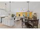 Spacious open concept living area combines kitchen, dining, and living space with tile floors and lots of sunlight at 12004 Legacy Bright St, Riverview, FL 33578