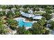 Aerial view of the community pool and surrounding recreation area with lush landscaping at 12004 Legacy Bright St, Riverview, FL 33578