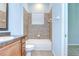 Bathroom with a shower-tub combo, modern fixtures, and ample counter space at 1208 Carriage Park Dr, Valrico, FL 33594