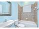 Cozy bathroom with a shower-tub combo, pedestal sink, and modern fixtures at 1208 Carriage Park Dr, Valrico, FL 33594