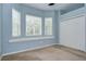 Bedroom featuring large windows, a built-in bench, and a spacious closet at 1208 Carriage Park Dr, Valrico, FL 33594