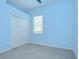 Comfortable bedroom with large closet and natural light from a window at 1208 Carriage Park Dr, Valrico, FL 33594